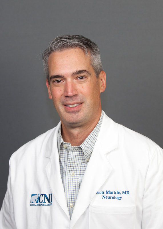 Physician in white lab coat for Coastal Neurological Institute